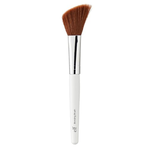 Discover the e.l.f. Angled Bronzing Brush, featuring soft bristles and a sleek white handle, perfect for flawless bronzing application.