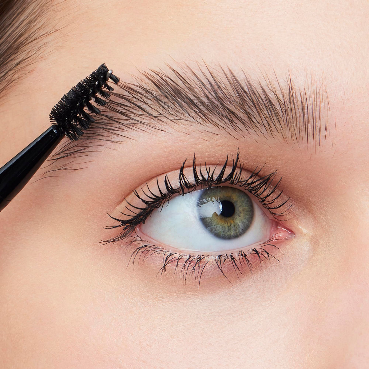 e.l.f. Brow Lift Applicator in action, enhancing brows with precision, showcasing original packaging and design.