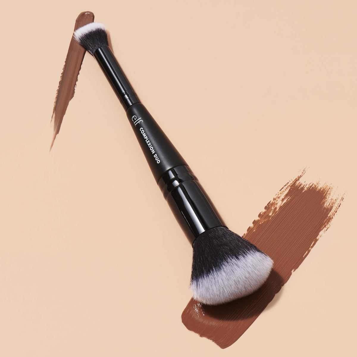 The e.l.f. Complexion Duo Brush features high-quality bristles and an official packaging, perfect for flawless makeup application. Available at Curat Cart.