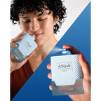 Khadlaj Shiyaaka Snow – Citrus and woody scent, premium imported fragrance in a textured light blue bottle.