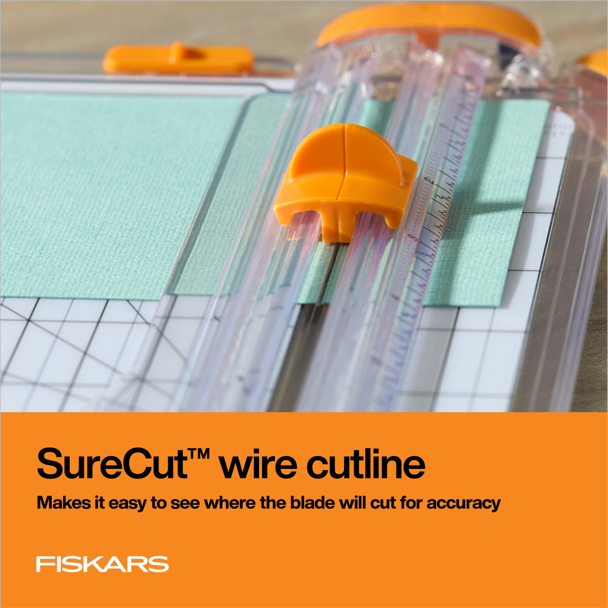 Fiskars SureCut Paper Cutter features a precise wire cutline for accurate cuts, showcased in high-quality packaging at Curat Cart.