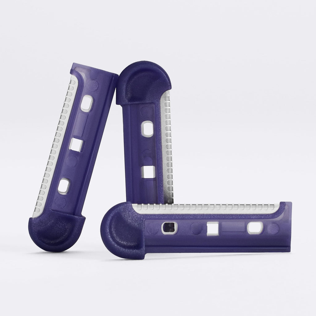 Set of three official Flamingo dermaplane blade refills in vibrant purple for smooth skin exfoliation.