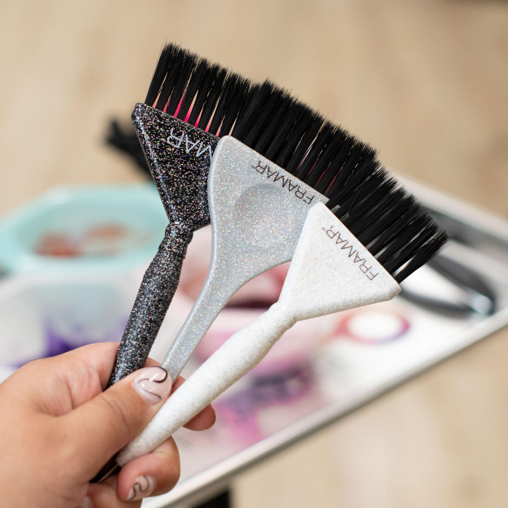 Three stylish hair color brushes in black, white, and glitter. Perfect for precise application. Verified by CuratCart.