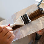 Authentic Framar Family Hair Color Brush Set. User applies dye to hair, ensuring precise application with a sturdy brush.