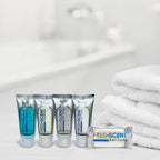 Authentic Freshscent 0.5 oz bar soap in a 100-pack, ideal for hotels, travel, or personal use, with plush towels in background.