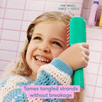 Frida for Kids detangling hair brush shown on a smiling child; tames tangles without breakage, perfect for waves and curls.