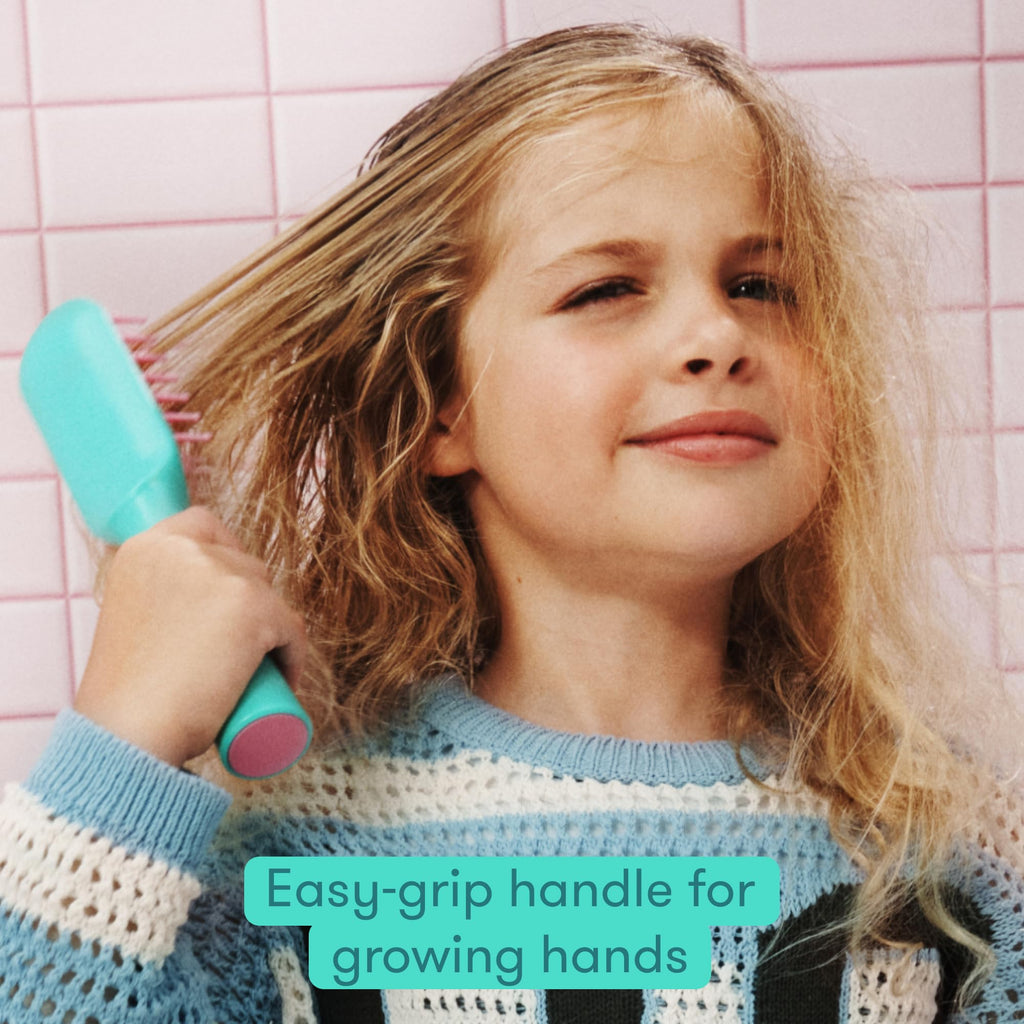Frida for Kids Detangling Hair Brush features an easy-grip handle, perfect for children's hair care and styling.