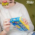 Child holding the Funko Bitty POP! 4 Pack featuring Disney characters, with bright packaging. Verified by CuratCart.