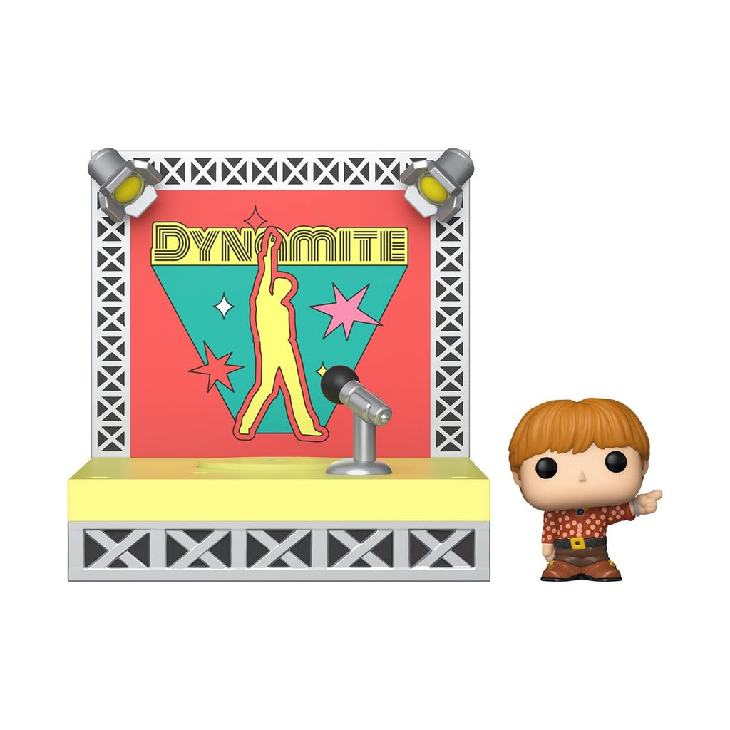 Funko Bitty POP! figure from BTS's Dynamite, standing next to a vibrant stage backdrop. Verified by CuratCart.