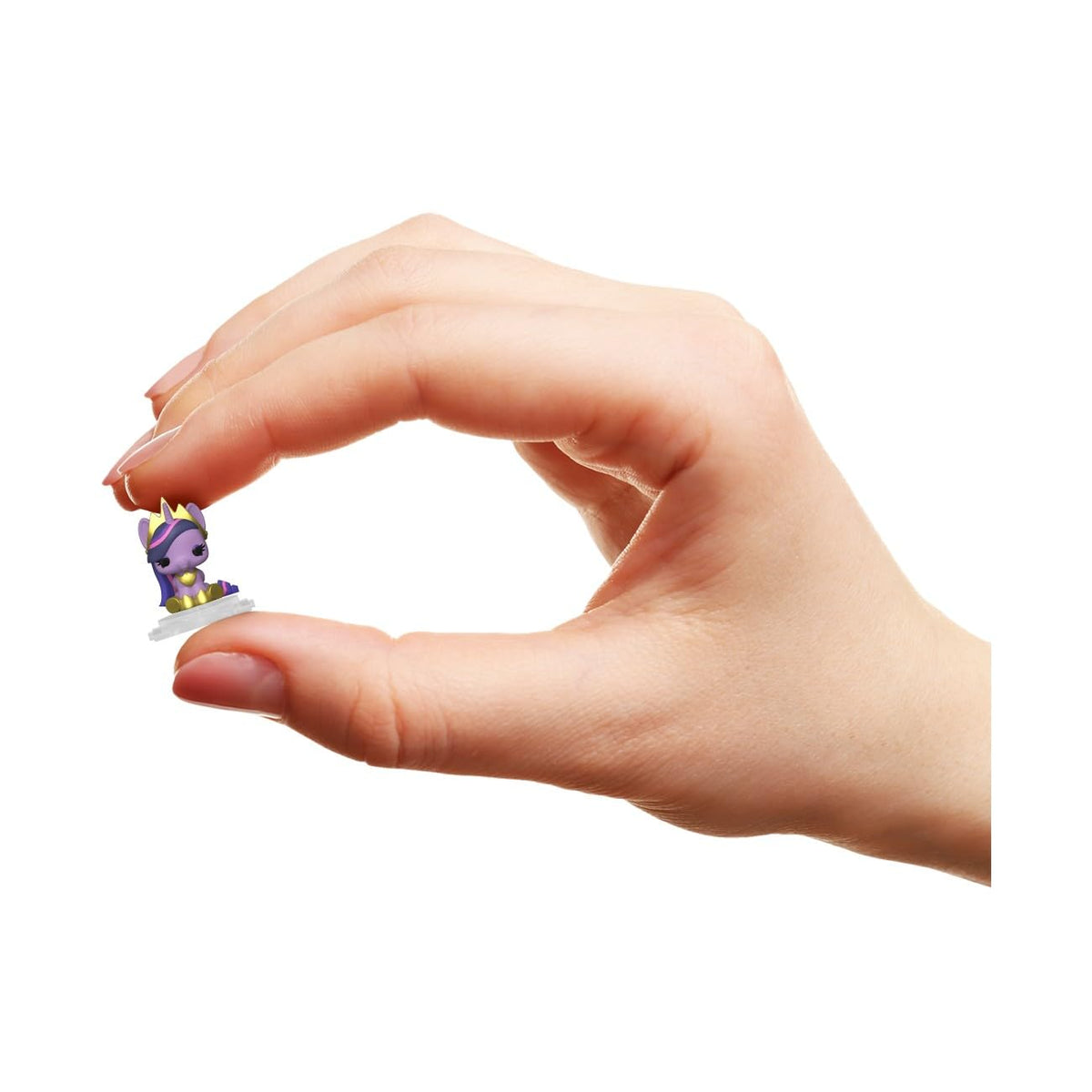 A hand holds a tiny Funko Bitty POP! Town My Little Pony figure, showcasing its vibrant colors and adorable design. Verified by CuratCart.