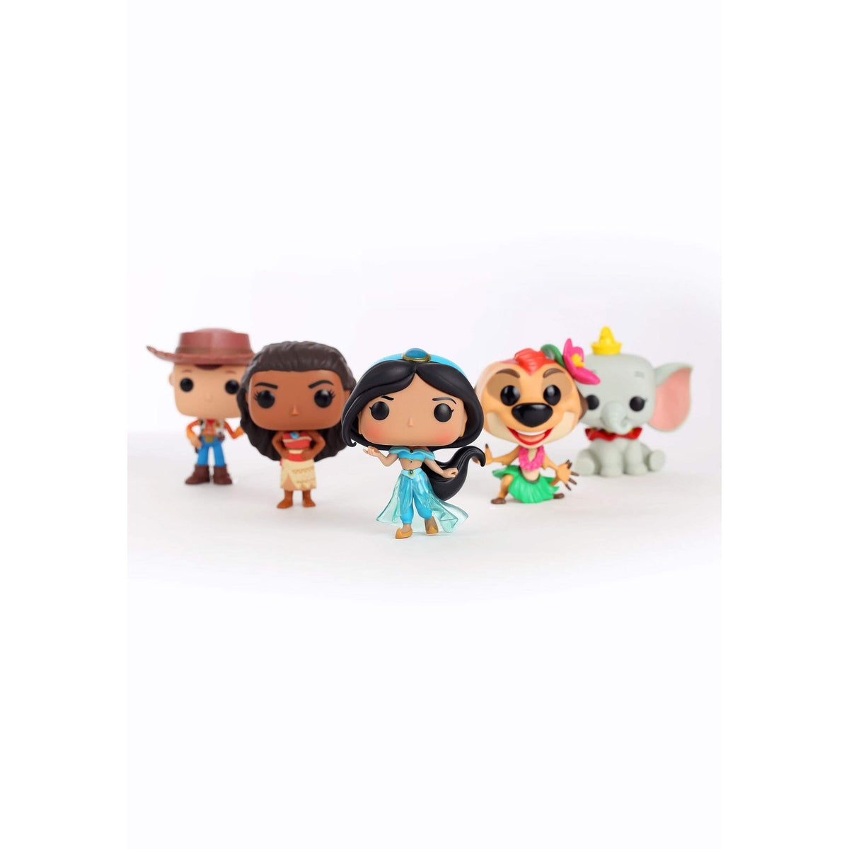 Funko Pop Disney Jasmine figure in iconic blue dress, surrounded by themed figures. Verified by CuratCart for quality assurance.