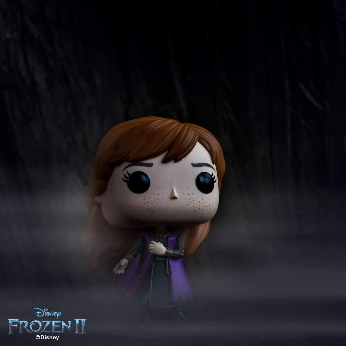 Authentic Funko POP! figure of Anna from Disney's Frozen 2, featuring her signature look in a mystical setting.