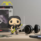 Authentic Metallica Funko POP! figure of Robert Trujillo, 4 inches tall, with a bass guitar, on a stylish tabletop setup.