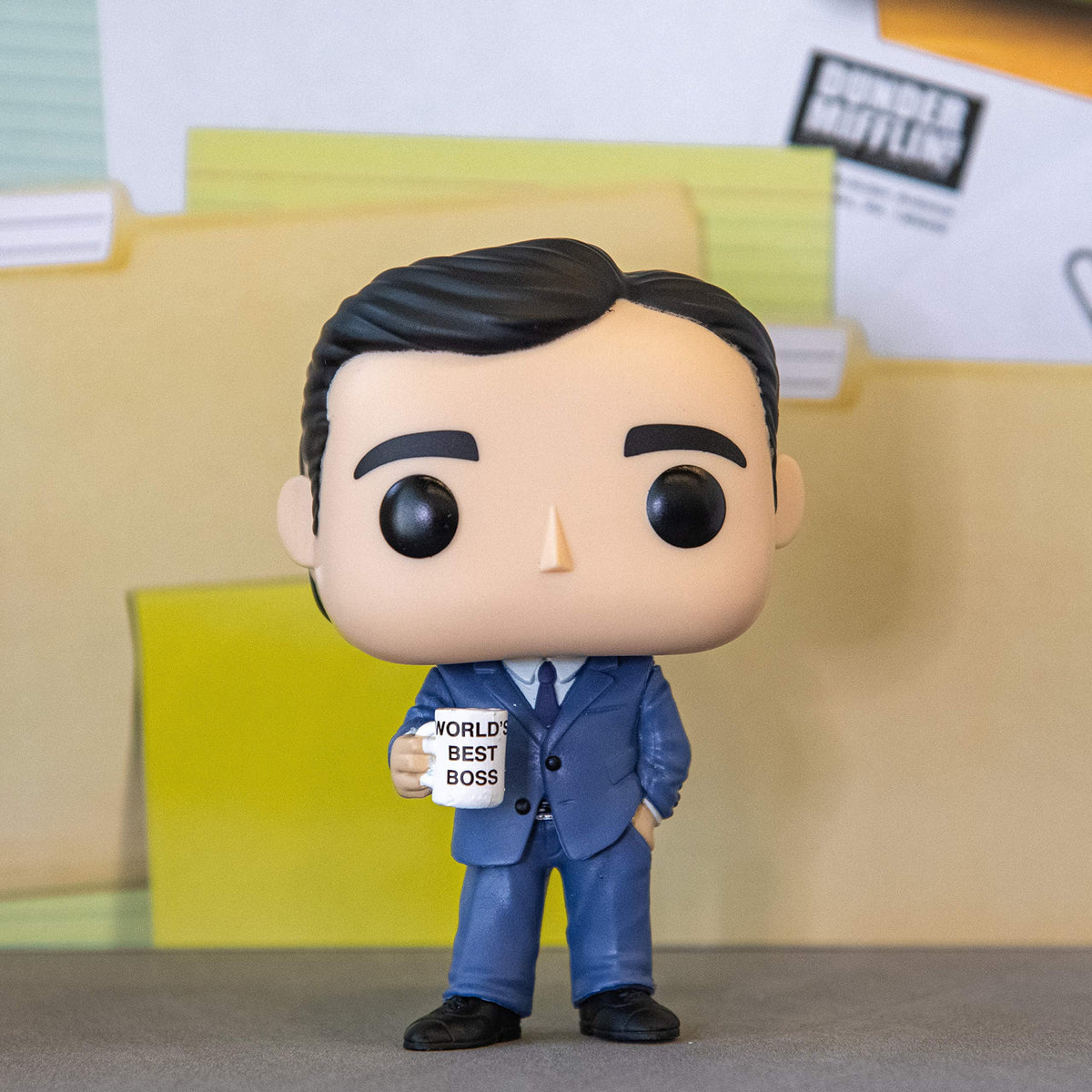 Authentic Funko POP! figure of Michael Scott from The Office, holding a 'World's Best Boss' mug in a suit.