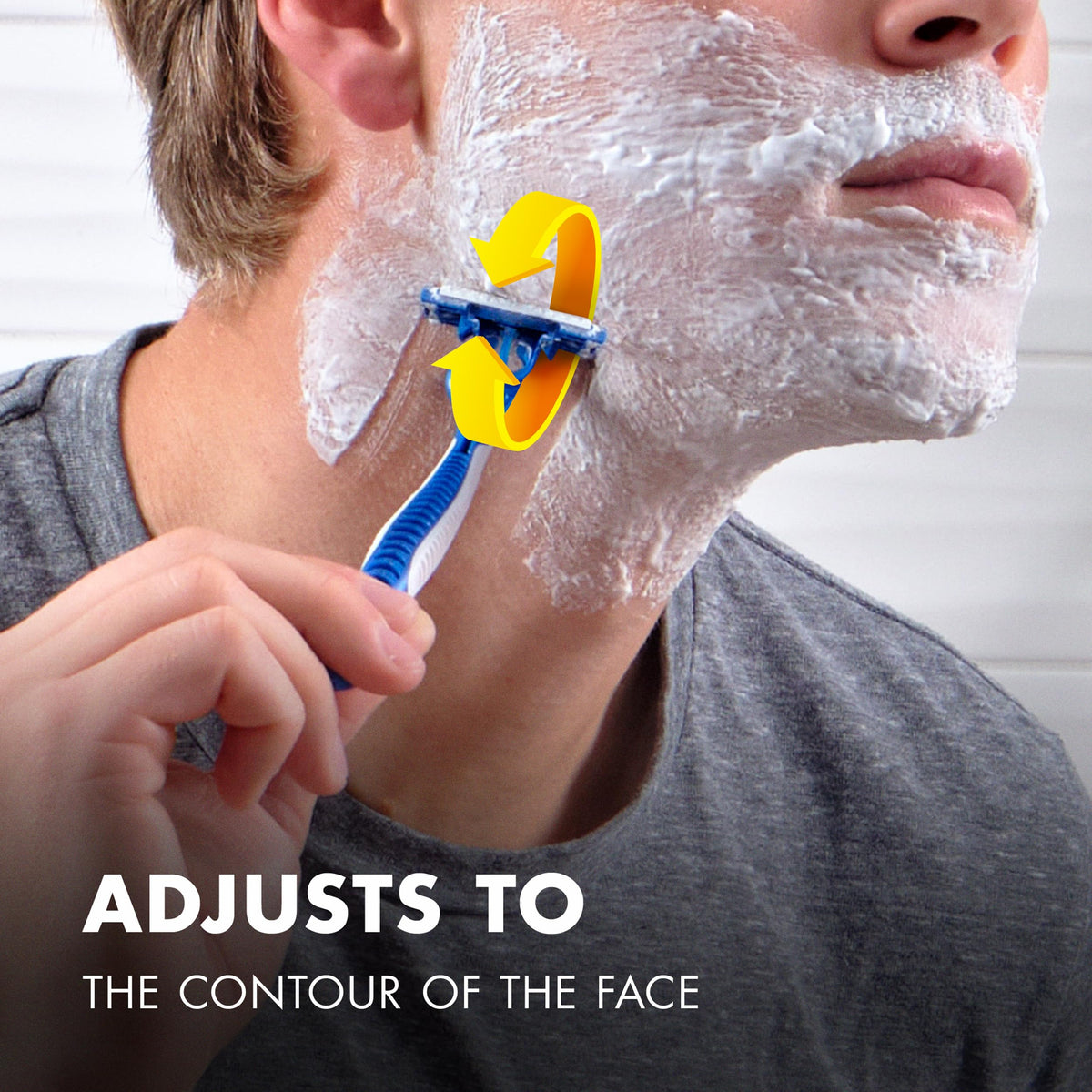 Gillette SkinGuard razor shown in use, designed to adjust to facial contours for a smooth shave experience.