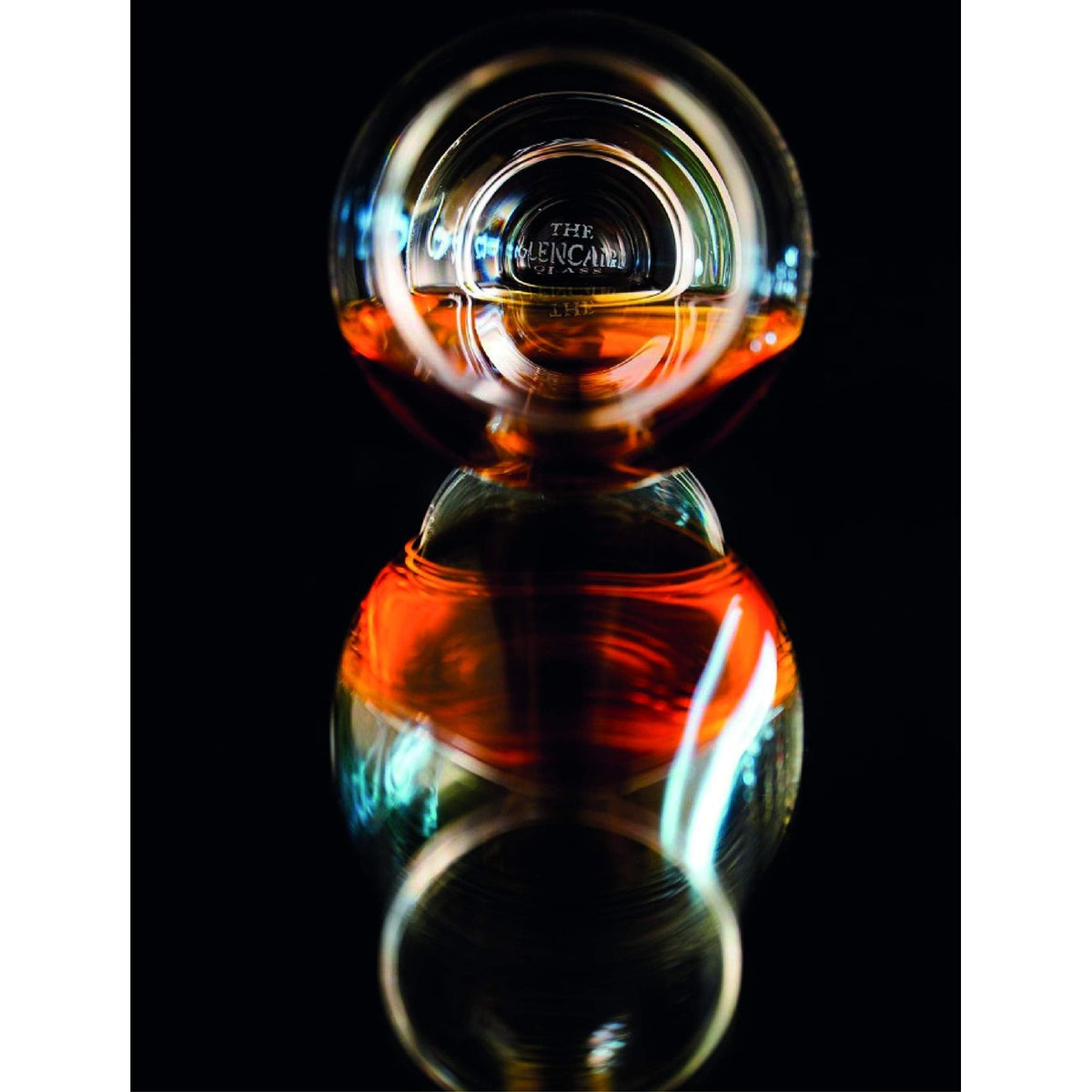 Premium imported Glencairn whiskey glass reflecting rich amber whiskey, perfect for enthusiasts and collectors.