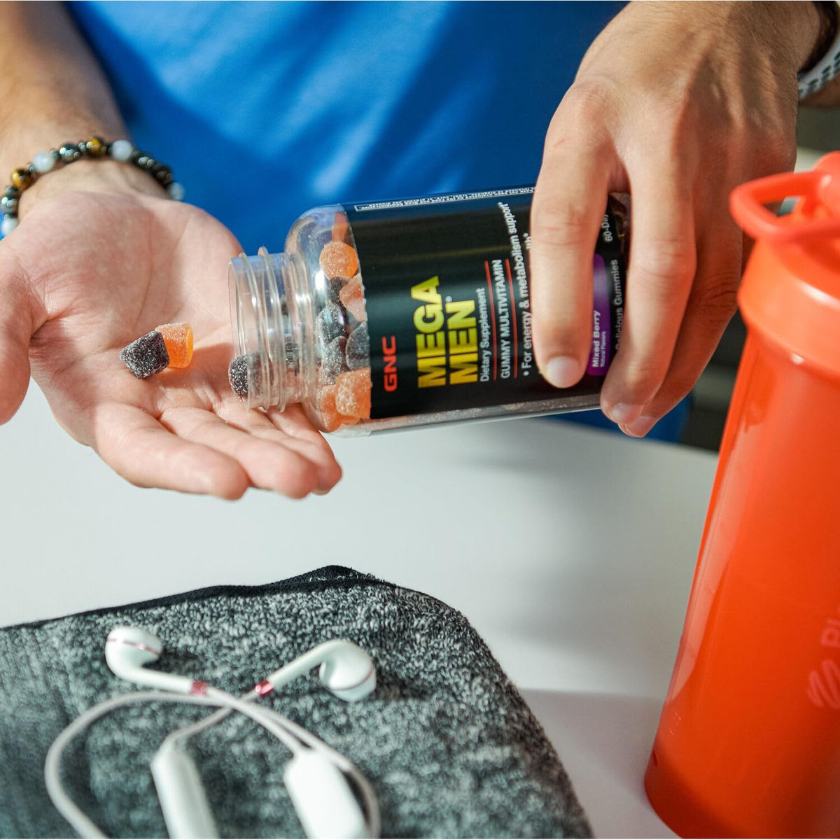 GNC Mega Men Multivitamin Gummies in hand. Verified by CuratCart for quality and trust. Enjoy daily nutrition!