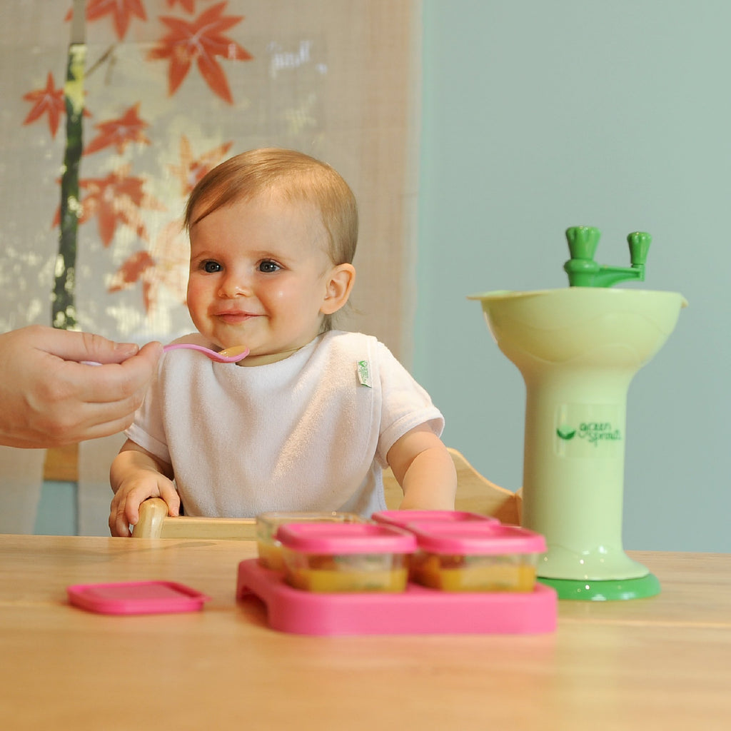 Green Sprouts Baby Food Mill in use, promoting healthy meals for infants. 100% Authentic, Available in India at Curat Cart.