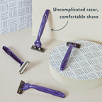 Harry's 10-count disposable razors in purple, offering a comfortable shave. Verified by CuratCart for quality assurance.