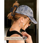 A woman wearing a baseball cap and sunglasses, showcasing a hat-friendly claw clip securely holding her hair. Verified by CuratCart.