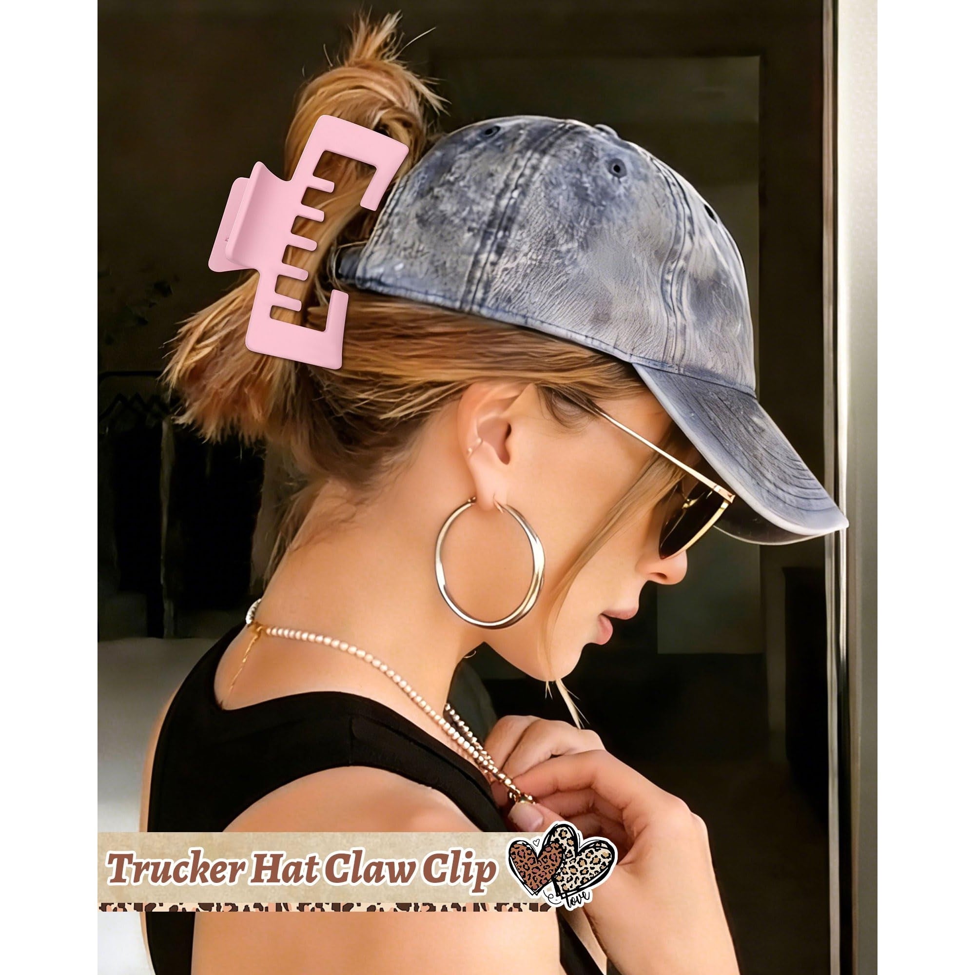 A trendy claw clip securely holds hair, complementing a cap-wearing style. Perfect for fashion and convenience.