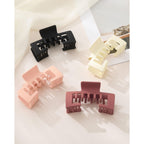 Stylish claw clips in black, cream, pink, and burgundy. Perfect for hats and baseball caps. Verified by CuratCart.