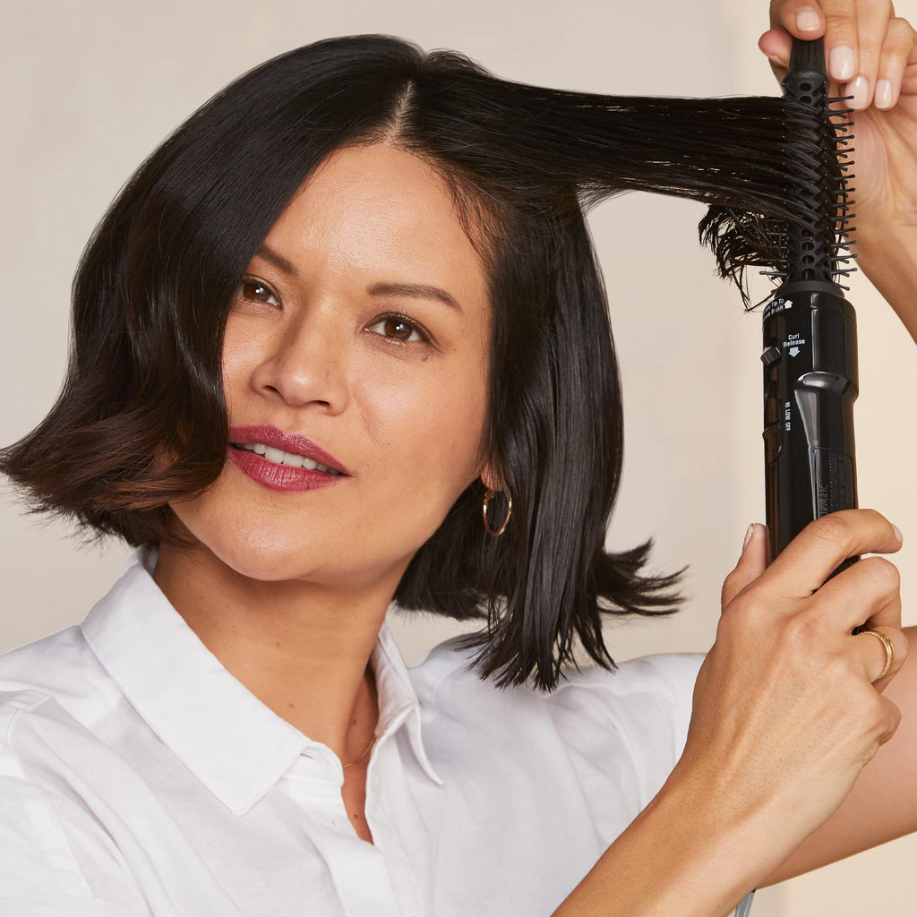 Authentic Hot Tools Pro Artist Hot Air Styling Brush shown in use, delivering smooth, styled hair effortlessly.