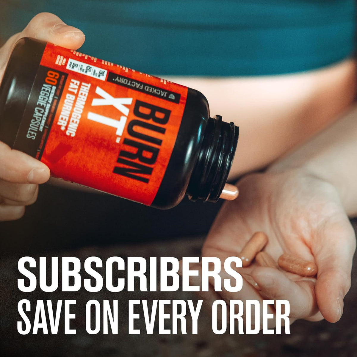 Jacked Factory Burn-XT Fat Burner capsules being poured from original packaging, promoting weight loss and energy.
