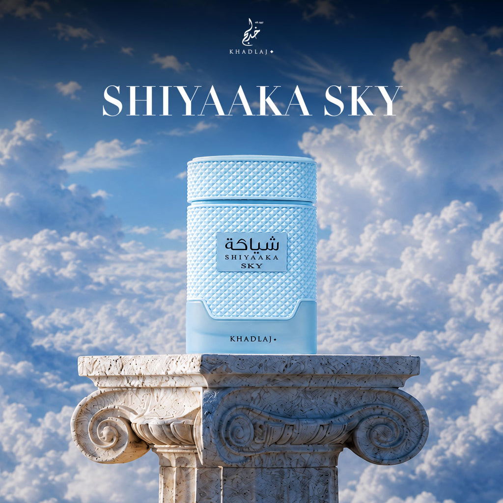 Khadlaj Shiyaaka Sky perfume displayed atop a classic column, surrounded by a beautiful blue sky.
