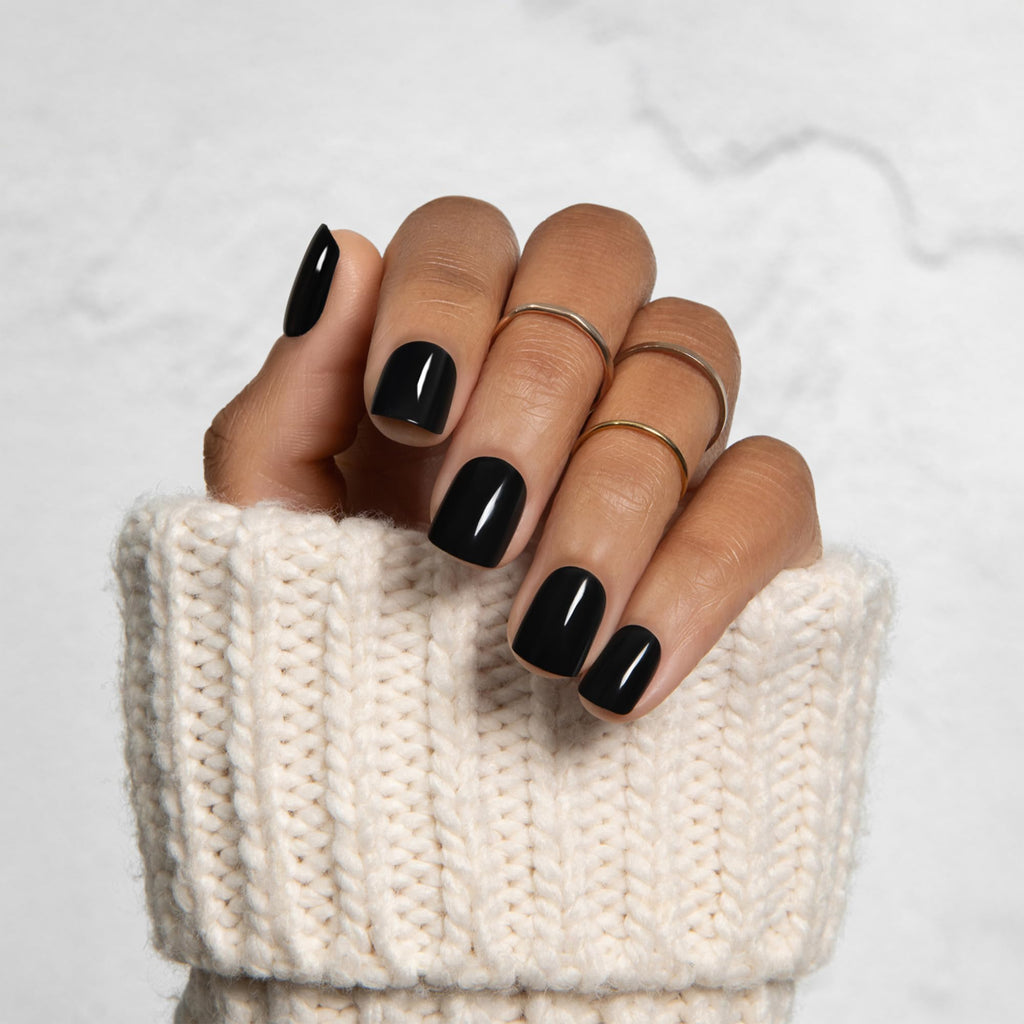 Stylish black press on nails by Kiss Impress, offering a no-glue application for easy, premium nail styling.
