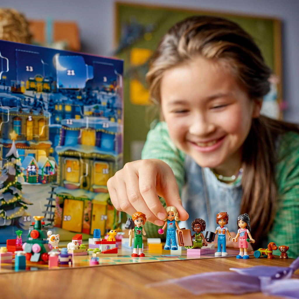 A girl joyfully plays with the LEGO Disney Princess set, featuring colorful figures and accessories. Verified by CuratCart.
