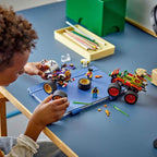 A child builds and races authentic Lego 60397 Monster Truck Race, featuring colorful vehicles and mini figures, promoting creativity.