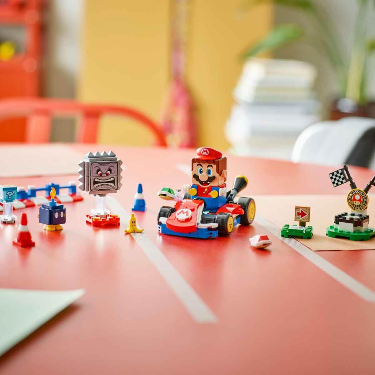 LEGO 71411 Super Mario set features Mario in a kart surrounded by obstacles. Order online for fun gaming adventures!