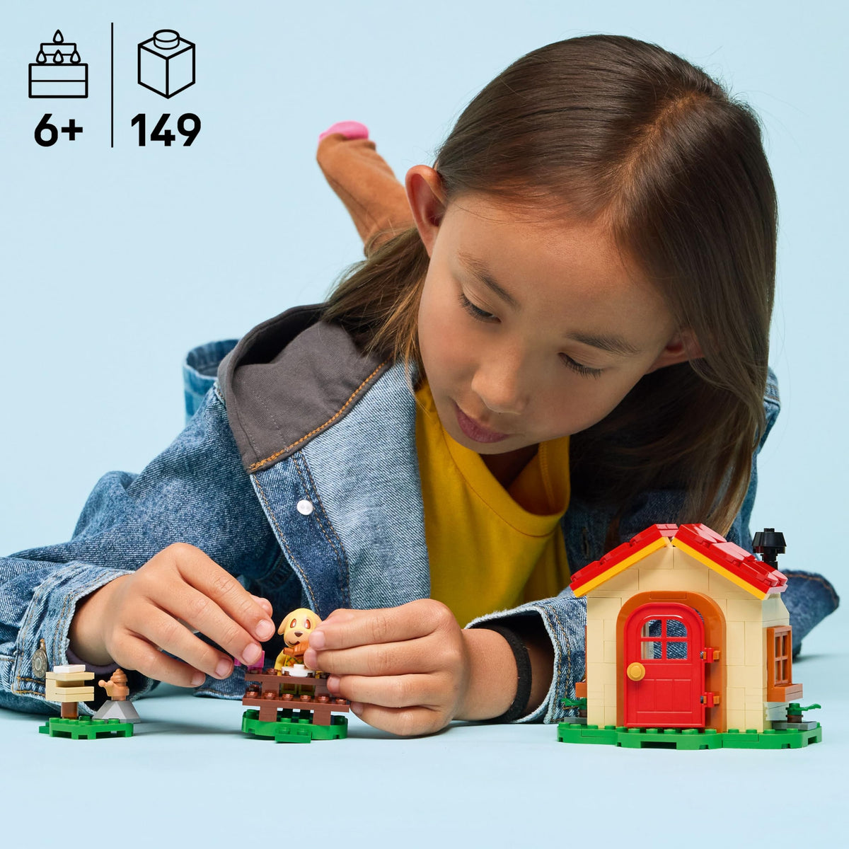 A child interacts with LEGO Animal Crossing Goldie’s Cozy House set. Available online, ideal for ages 6+. Order now!