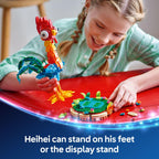 A child builds a vibrant LEGO Moana Heihei set, featuring Heihei and a display stand with tropical elements.