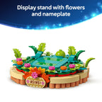 Authentic LEGO display stand featuring Heihei, surrounded by colorful flowers and greenery, perfect for collectors.