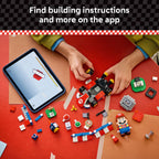 Authentic LEGO Mario Kart set with Mario figure, colorful building pieces, and tablet showing instructions for assembly.