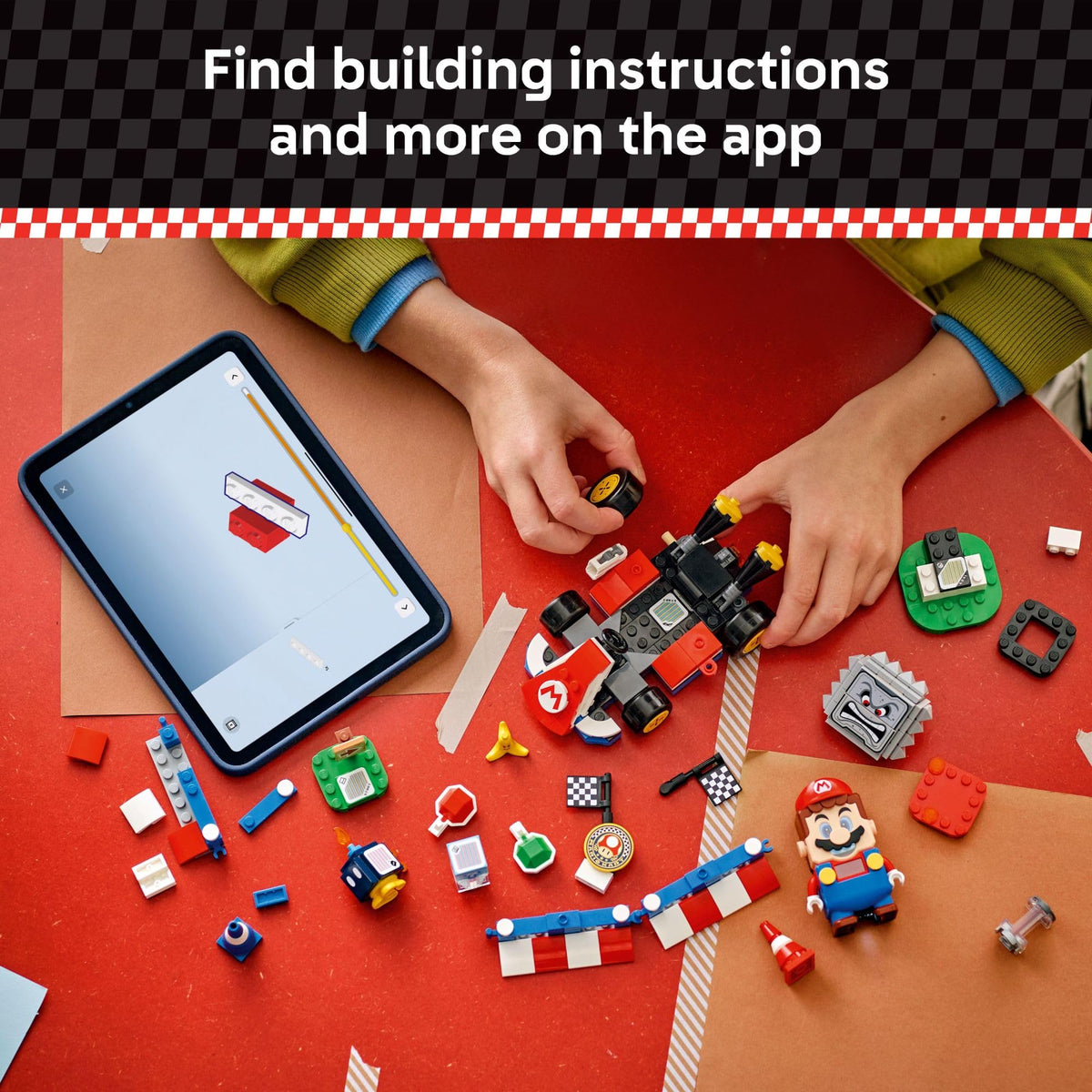 Authentic LEGO Mario Kart set with Mario figure, colorful building pieces, and tablet showing instructions for assembly.