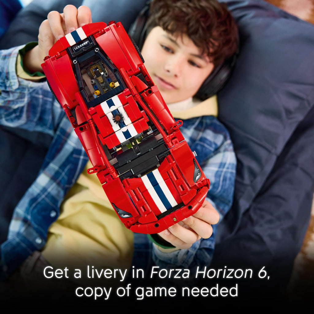 Child interacting with LEGO Technic Ferrari 488 Pista model, complete with original packaging. Perfect for car enthusiasts!