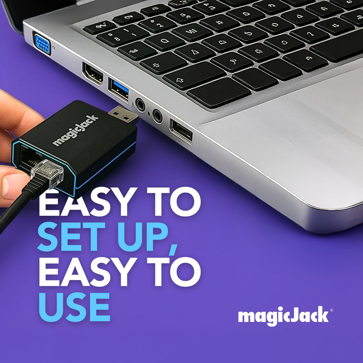 magicJack VOIP Phone Adapter plugged into a laptop, showcasing easy setup and user-friendly design.