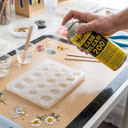 Mann Ease Release Mold Release Agent in hand, perfect for crafting and preventing mold sticking, exclusively at Curat Cart.