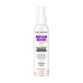 Marc Anthony Repair Bond Leave-In Treatment in white spray bottle, perfect for all hair types, enhances strength and shine.