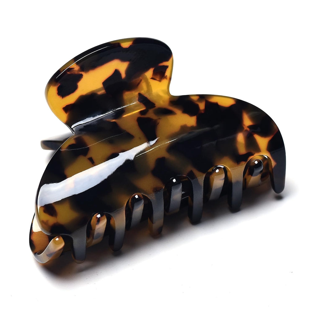 Elegant medium claw hair clip in tortoiseshell pattern. Perfect for securing hair. Verified by CuratCart.