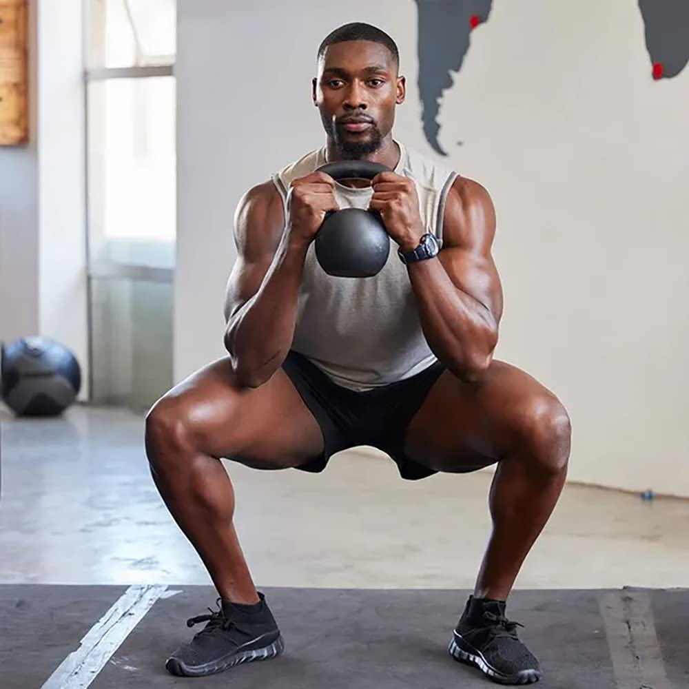 Men's Health Kettlebells Transformation showcases a high-quality kettlebell in a dynamic squat position, perfect for fitness enthusiasts. Available at Curat Cart.