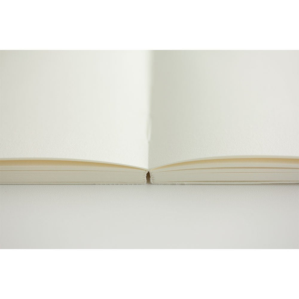 Discover the Midori MD A5 Plain Paper Notebook with high-quality, blank pages perfect for creative writing. Available at Curat Cart.