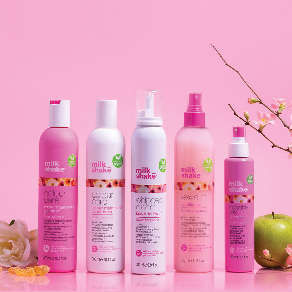 Milk_shake Whipped Cream Leave-In Foam among other pink hair care products, showcasing original packaging and vibrant branding.