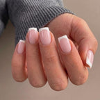 Elegant short French tip press-on nails in a natural pink and white design, perfect for any occasion.