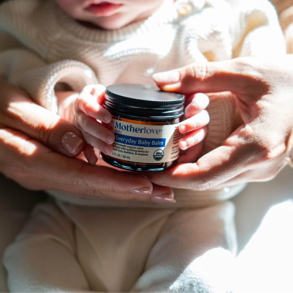 Motherlove Everyday Baby Balm in hands, specially curated by Curat Cart for your baby's skincare needs.