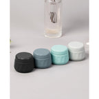 Set of four Mrsdry travel containers. Authentic, compact, and perfect for organizing toiletries on the go.