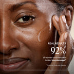 Close-up of a woman applying No7 Future Renew Damage Reversal Anti-Aging serum, showcasing radiant skin results.